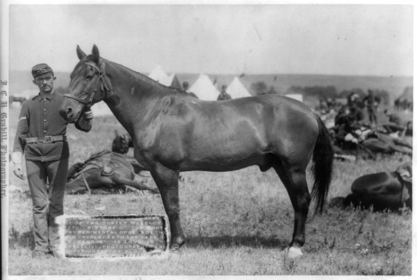 Comanche, with soldier on the plains, army tents in the background