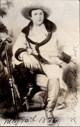 Henry M. Brinkerhoff casually sitting with rifle