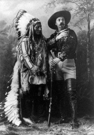A highly posed picture, both in their best attire.  Buffalo Bill stares off to his left and points.  Sitting Bull looks completely disinterested